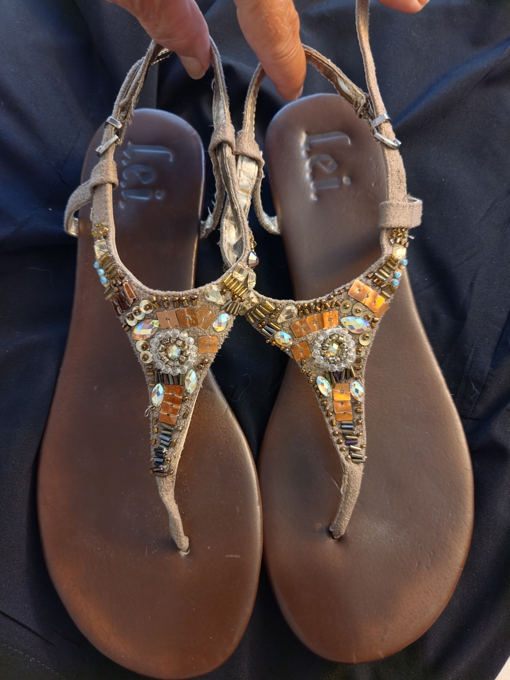 lei Brown Beaded T-Strap Sandals with Gold Accents
